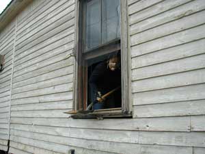 Rhonda shoveled the bricks from the chimney out the window!